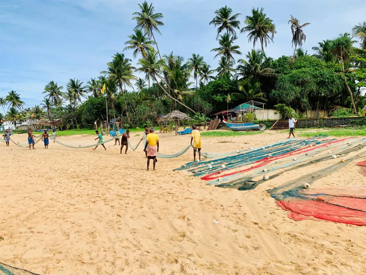 Local fishermen preparing nets on Narigama Beach